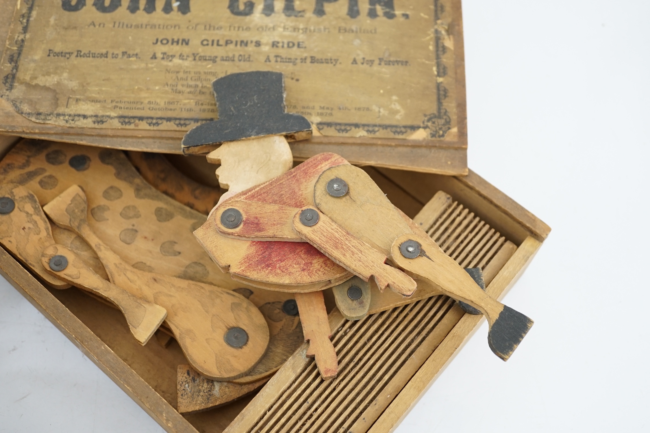 Grandall’s John Gilphin’s toy c.1876, with paperwork and original box, horse and rider and three toys